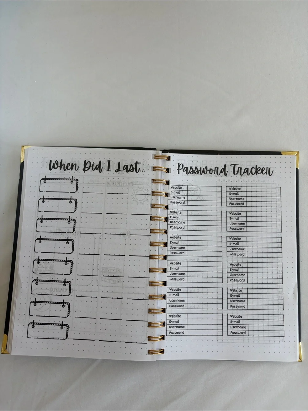 Bullet Journal Game Spiral Notebook in Black with Colored Pencils